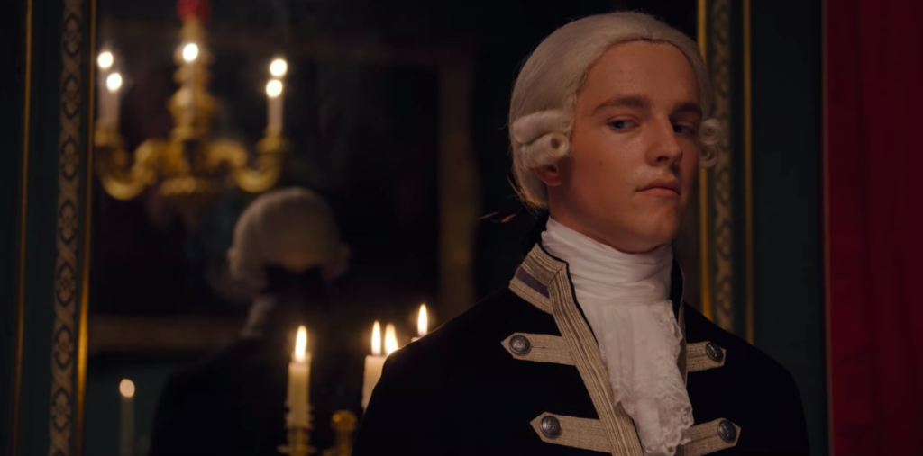One of Simon's servants glances sideways awkwardly.