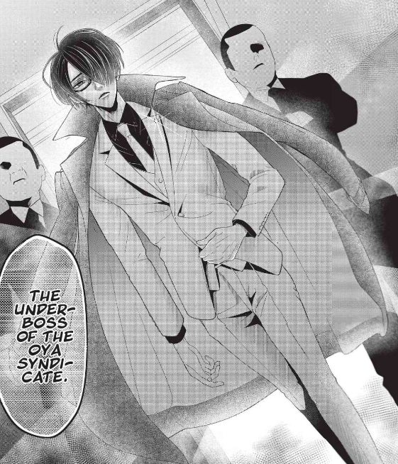 Oya enters the room, trench coat billowing out behind him.