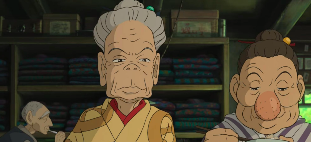 A stern elderly Kiriko sits beside another auntie and eyes the viewer.